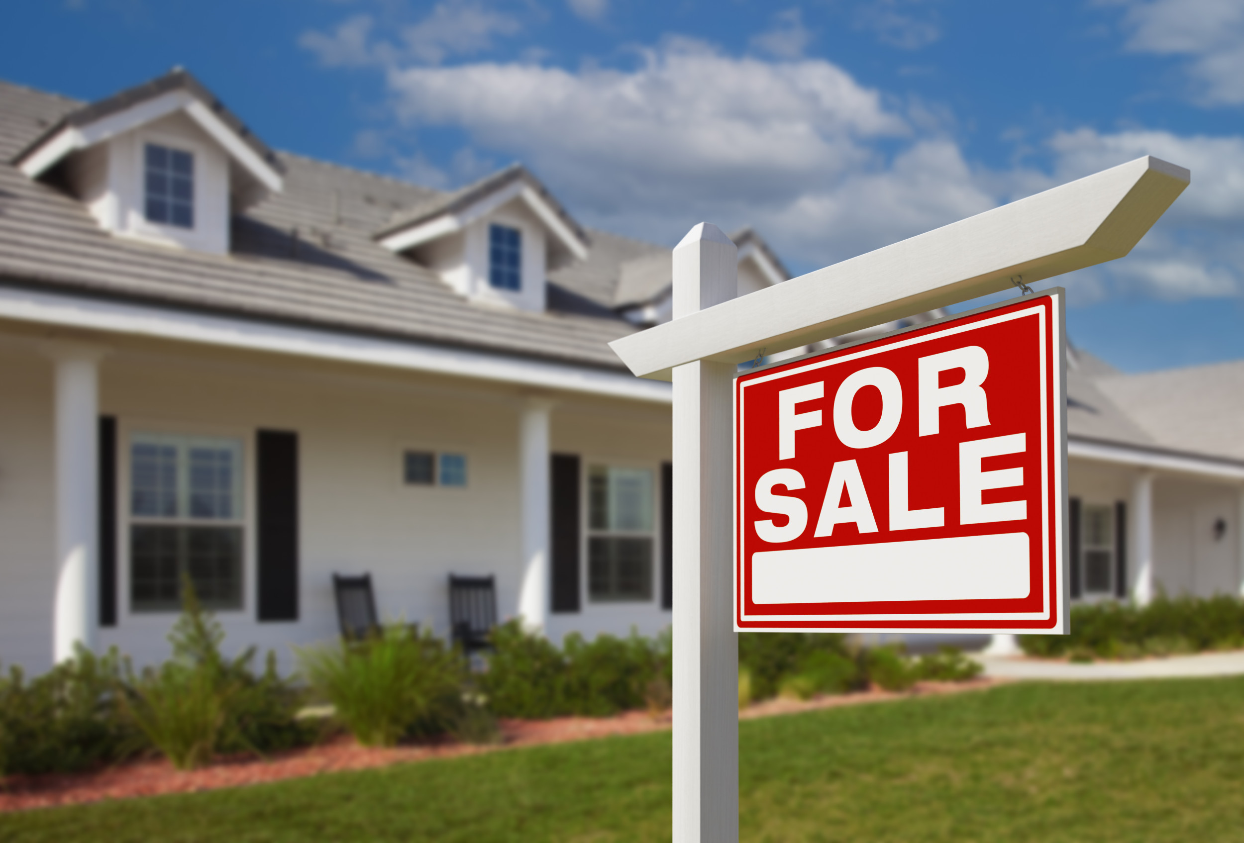 A stock image of a For Sale sign outside a home. (Getty)